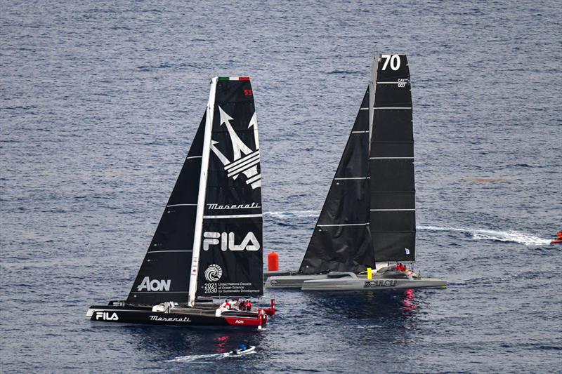 A photo finish for Maserati Multi70 and MOD70 Zoulou in the RORC Caribbean 600 photo copyright James Tomlinson taken at Royal Ocean Racing Club and featuring the MOD70 class