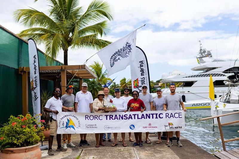 Nikoyan Roberts and Chinel Sandy from the Grenada Tourism Authority present Jason Carroll & Team Argo with a basket of Grenadian goodies. The team  received a warm welcome from the team at Camper & Nicholsons Port Louis Marina, including Fedon Stroude photo copyright Arthur Daniel / RORC taken at Royal Ocean Racing Club and featuring the MOD70 class