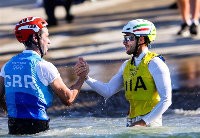 John Gimson (GBR - left) congratulates Ruggero Tita (ITA - right) while celebrating onshore. - photo © Sailing Energy / World Sailing