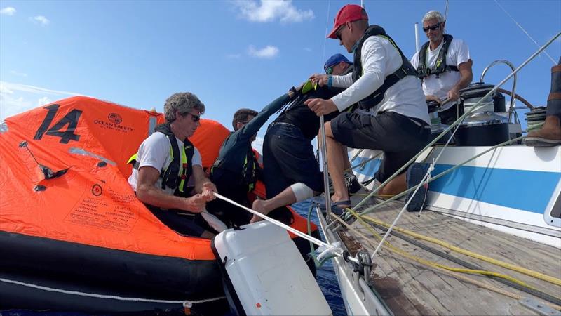 The crew of French OGR entrant Triana (66) FR assisted Stéphane Raguenes into the liferaft before being winched onboard the helicopter and flown to Madeira for medical attention - photo © OGR 2023 / Margault Demasles