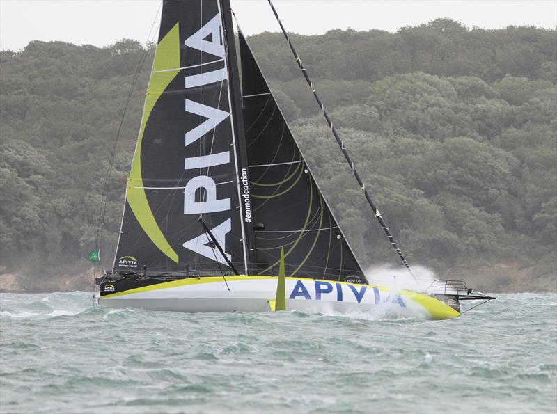 Apivia passes Hurst Castle after the Rolex Fastnet Race start - photo © Mark Jardine