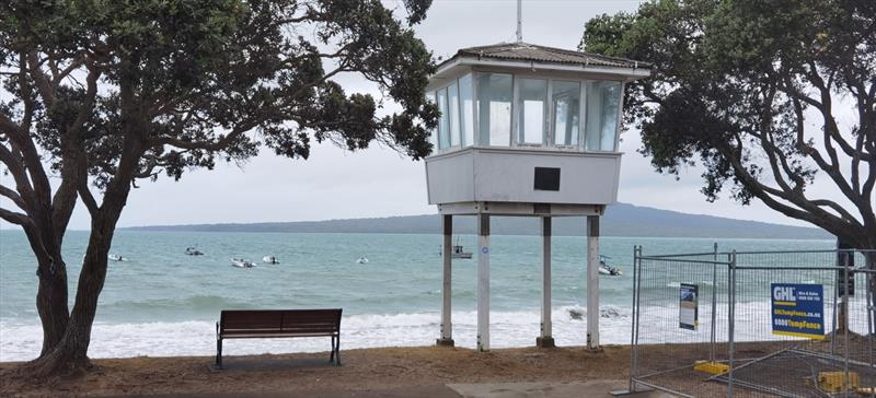 Sizeable surf in front of the Memorial start tower - constructed in 1960 by the Club in memory of the 10 Club sailors who lost their lives in World War 2 - Wakatere BC - Optimist and Starling Auckland Championships - February 5, 2022 - photo © Richard Gladwell - Sail-World.com/nz