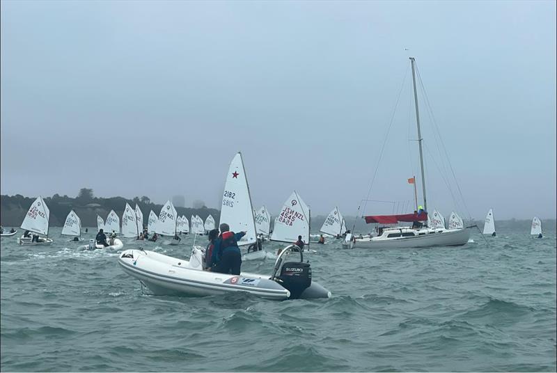 The Open Optimist fleet line up for a start in the murk - Auckland Optimist and Starling Championships - February 2022 photo copyright Jane Pilkington taken at Wakatere Boating Club and featuring the Optimist class