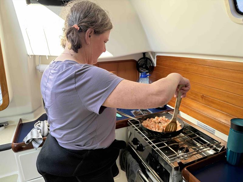 KAM saved my bacon by helping to cook a rice stir fry dinner with fresh and local black tiger prawns - photo © David Schmidt