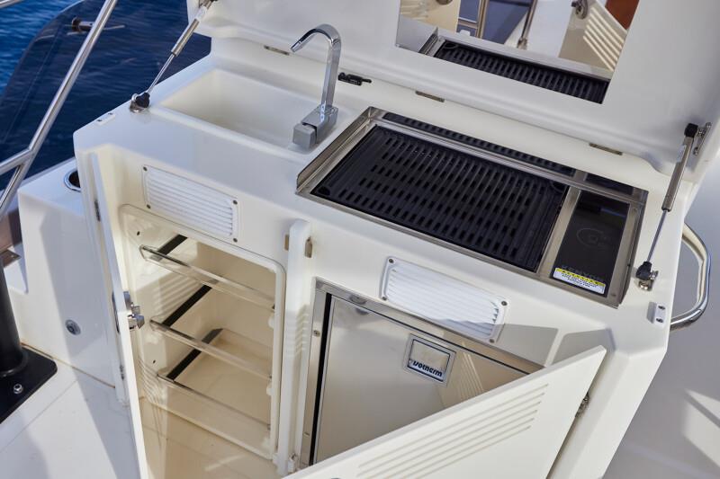 On the bridge deck is the grill, sink, and fridge. Prestige's new M48 powercat photo copyright Prestige Yachts taken at  and featuring the Power boat class