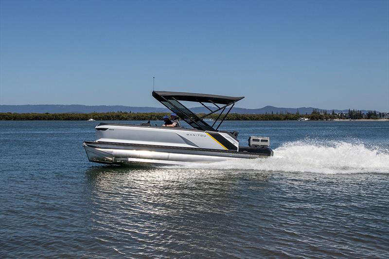 Manitou Explore 22 MAX - shining away in the sun - the planing or lifting strakes on both sides of each pontoon certainly do the job - photo © John Curnow