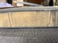 Sprint 20S - Cross section of the cabintop panel. Shows complete resin penetration of the core, and a laminate void of any air entrapment