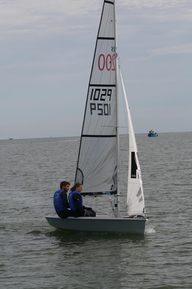 63rd Endeavour Trophy Day 2: Finley Dickinson and Elysia O'Leary (ILCA) win the first race of the day by 2.5 minutes photo copyright Sue Pelling taken at Royal Corinthian Yacht Club and featuring the RS200 class