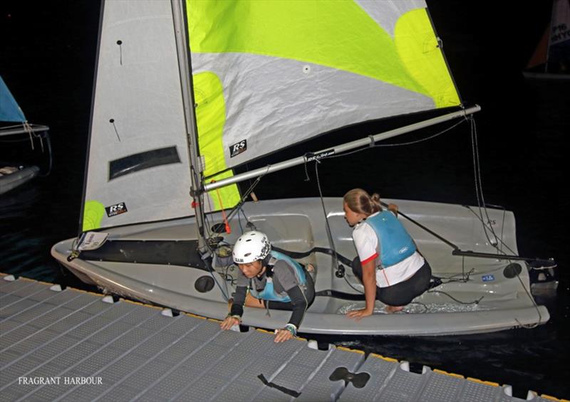 Lions make a crew change at night - 24 Hour Charity Dinghy Race photo copyright Fragrant Harbour taken at Hebe Haven Yacht Club and featuring the RS Feva class