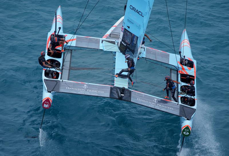 Great Britain SailGP team running across the F50 as they make a manoeuvre in Race Day 1 of Bermuda SailGP  Season 3, in Bermuda. May 2022 photo copyright Bob Martin/SailGP taken at Royal Bermuda Yacht Club and featuring the  class