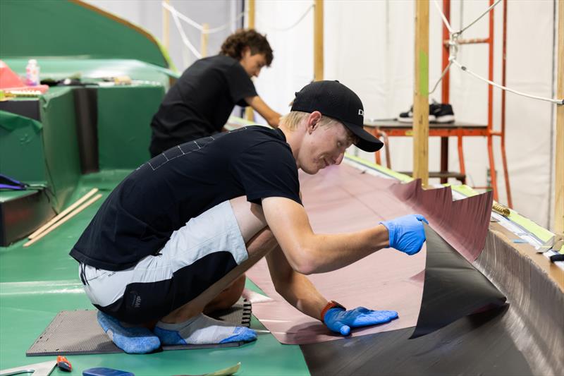 Sean layering pre-preg to a TP52 deck mould - SailGP Technologies - Warkworth, New Zealand - February 2023 - photo © Brett Phibbs/SailGP Technologies