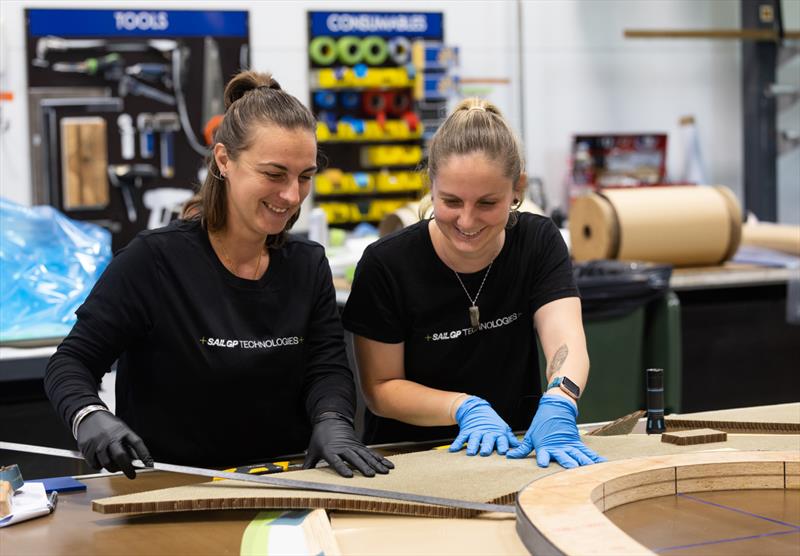 Shirvanie and Ashlee fixing Nomex to a bulkhead jig - SailGP Technologies - Warkworth, New Zealand - February 2023 - photo © Brett Phibbs/SailGP Technologies