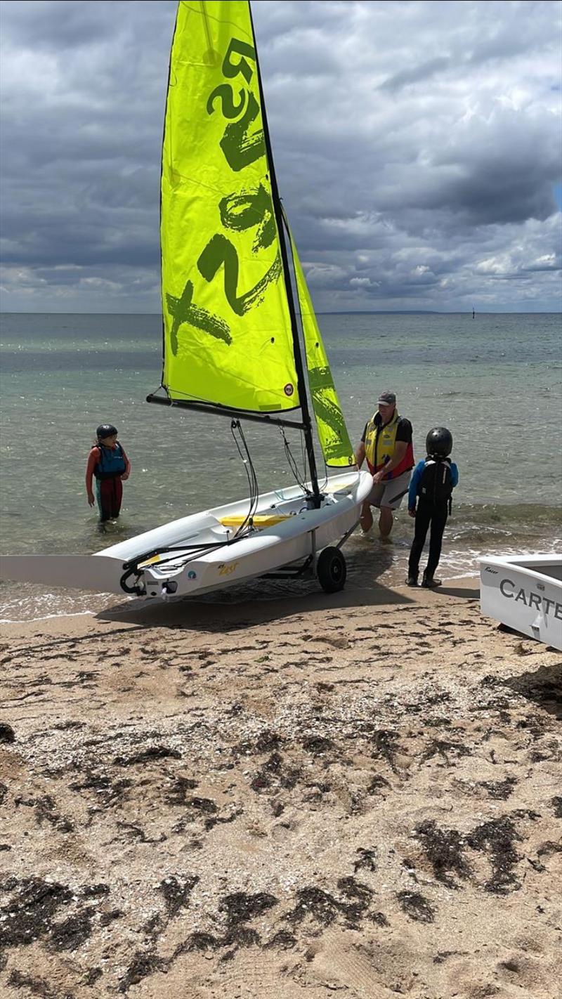 When the Optimist training is over in the Carter it's time for some fun with dad in the Zest. Smiles all round! photo copyright Sailing Raceboats taken at  and featuring the  class