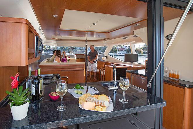 Galley operates easily for guests both indoors and out. © Multihull Central