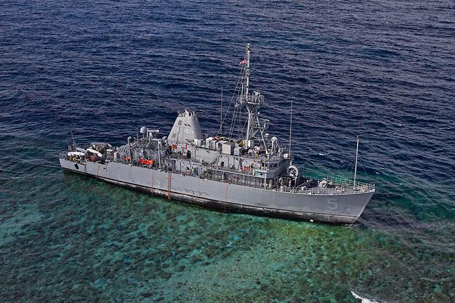 USS Guardian on the clearly identifiable bricks with lovely blue waters behind. © US Navy