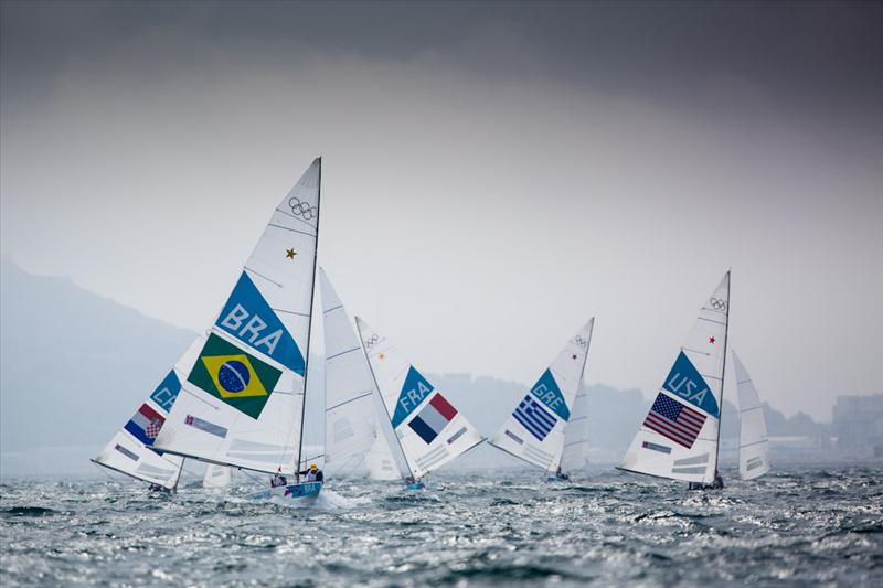 Star fleet on day three of the London 2012 Olympic Sailing Competition photo copyright Tom Gruitt / www.tom-gruitt.co.uk taken at Weymouth & Portland Sailing Academy and featuring the Star class