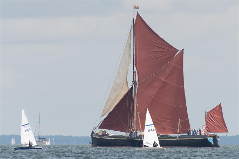 Thames Barge crossing the course on day 2 of the Noble Marine Streaker National Championship at Stone Sailing Club photo copyright Paul Sanwell / OPP taken at Stone Sailing Club and featuring the Streaker class
