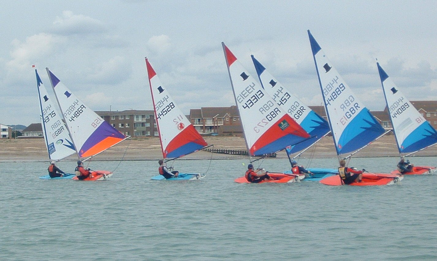 The fleet sail downwind at the Arun Topper Travellers event photo copyright AYAC taken at Arun Youth Aqua Centre and featuring the Topper class