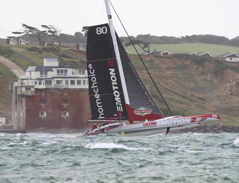 UltimEmotion2 passes Hurst Castle after the Rolex Fastnet Race start photo copyright Mark Jardine taken at Royal Ocean Racing Club and featuring the Trimaran class