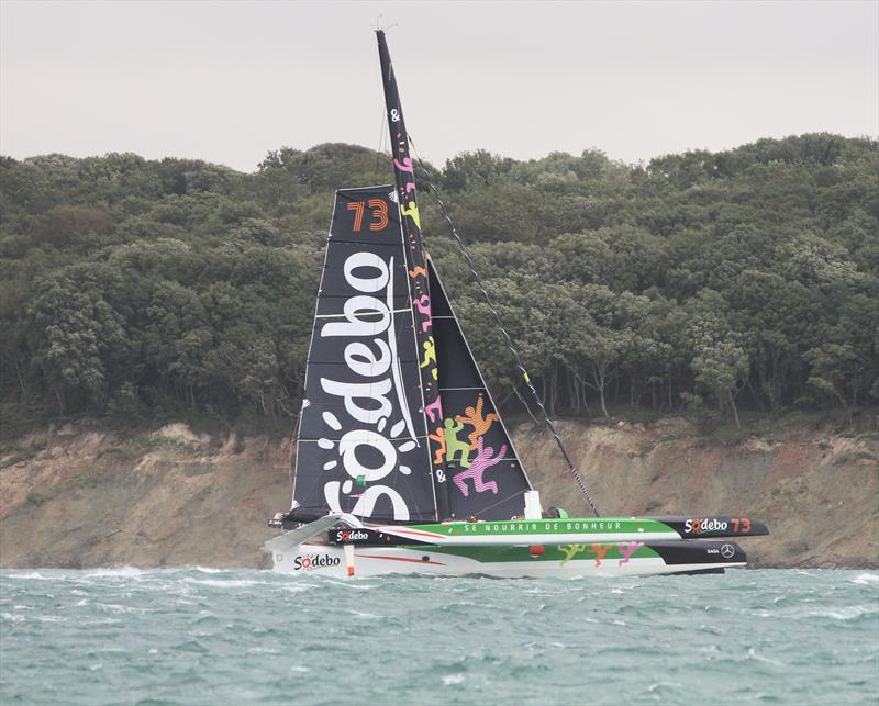 Sodebo passes Hurst Castle after the Rolex Fastnet Race start photo copyright Mark Jardine taken at Royal Ocean Racing Club and featuring the Trimaran class