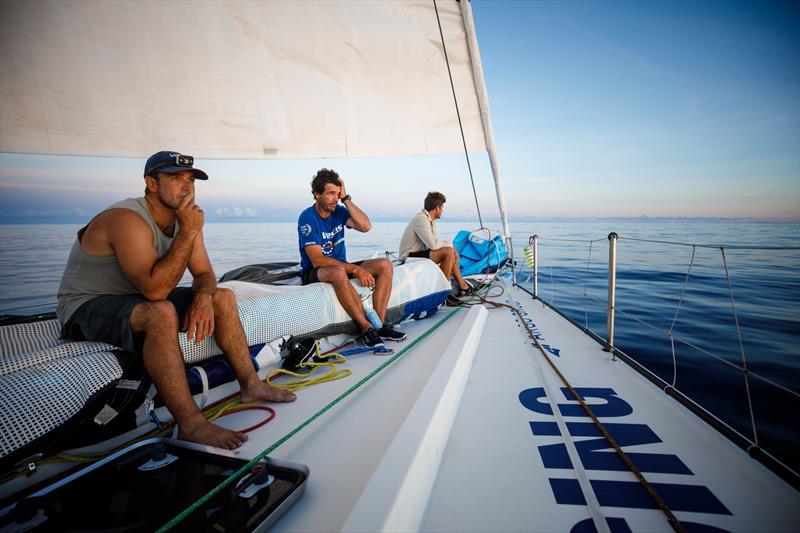 Leg 4, Melbourne to Hong Kong, day 08, Nick Dana, Roberto Bermudez, and Tom Johnson keep weight forward in the early hours on board Vestas 11th Hour photo copyright Amory Ross / Volvo Ocean Race taken at  and featuring the Volvo One-Design class