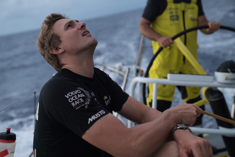 Leg 6 to Auckland, Day 12 on board Brunel. 18 February, . Kyle Langford holding the main sail on a nice and quiet evening photo copyright Yann Riou / Volvo Ocean Race taken at  and featuring the Volvo One-Design class