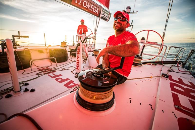 Volvo Ocean Race Leg 6 to Auckland, day 14 on board MAPFRE, Xabi Fernandez trimming, Pablo Arrarte stearing and Dongfeng (little black spot into the sun light. 20 February photo copyright Ugo Fonolla / Volvo Ocean Race taken at  and featuring the Volvo One-Design class
