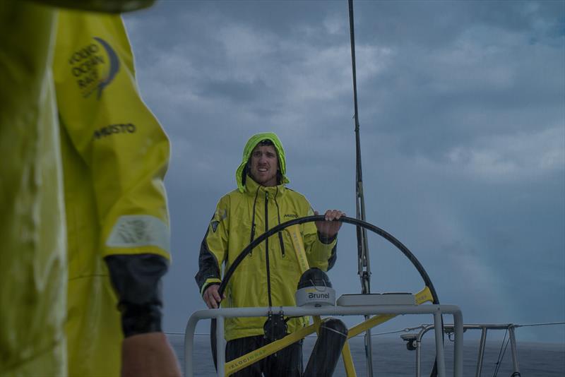 Leg 6 to Auckland, day 15 on board Brunel. 21 February, . Peter Burling driving under ther rain photo copyright Yann Riou / Volvo Ocean Race taken at  and featuring the Volvo One-Design class