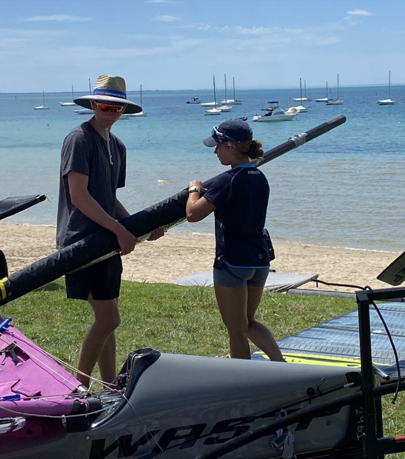 Louis Tilly helping a fellow competitior photo copyright Marc Ablett taken at Sorrento Sailing Couta Boat Club and featuring the WASZP class