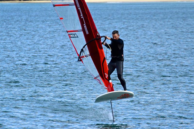 Olympic rep JP Tobin doing a foiling gybe in light winds  - Takapuna Beach - October 2018 photo copyright Richard Gladwell taken at Takapuna Boating Club and featuring the Windsurfing class