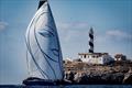 Layla passing Punta Figuera on Multihull Cup Day 1