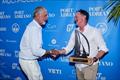 GT Rigging's Scott Gray awarding the prize to Allegra on Punta Figuera on Multihull Cup Day 2