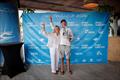 Punta Figuera on Multihull Cup Day 3 - Allegra racing skipper Paul Larsen lifting the Adriana Monk-designed Trophy awarded by Lisa Keller