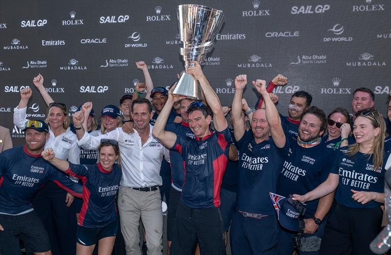 Dylan Fletcher, driver of Emirates Great Britain SailGP Team, lifts the SailGP Championship trophy Race Day 2 of the Mubadala Abu Dhabi Sail Grand Prix Season Grand Final - November 30, 2025 - photo © Christopher Pike/SailGP